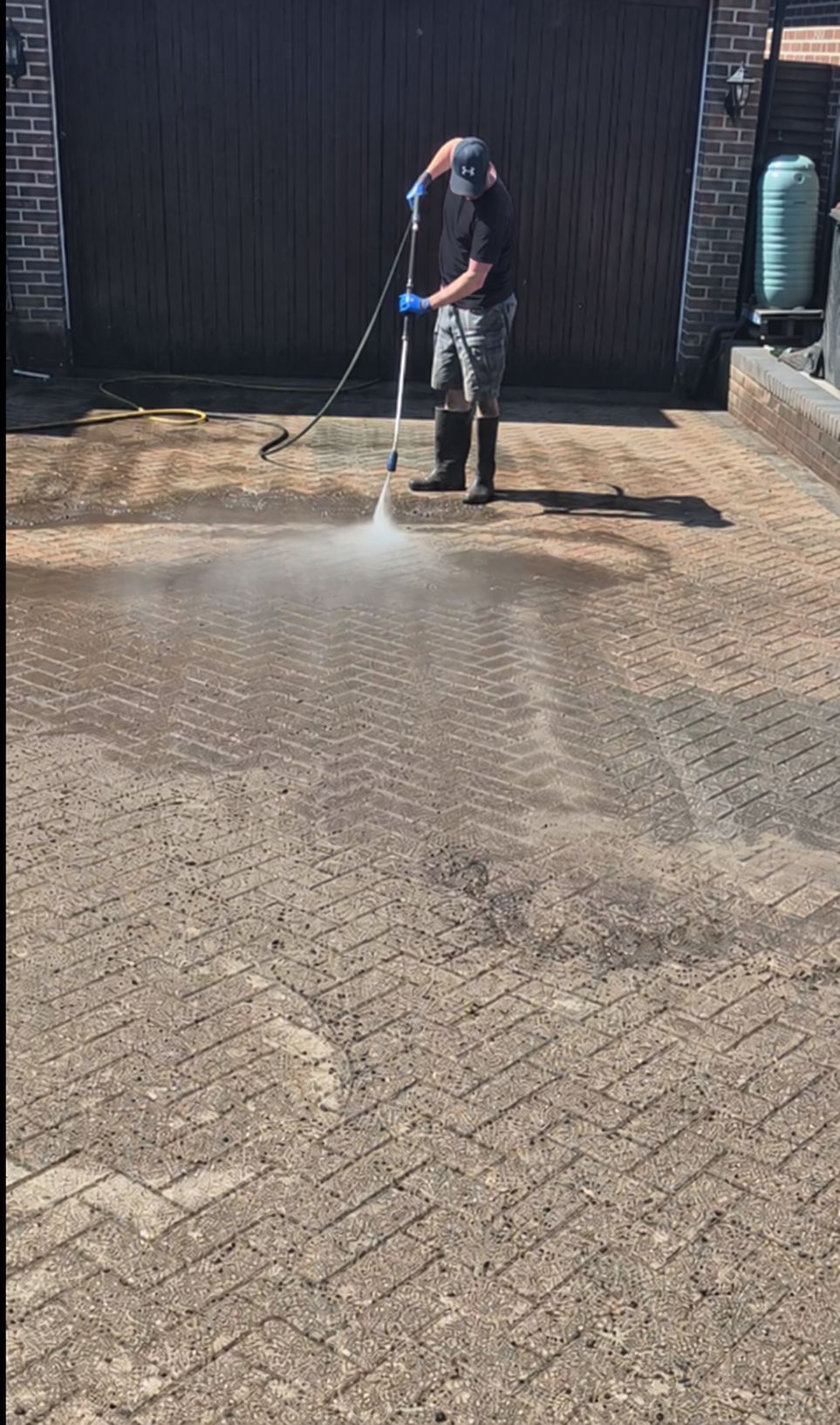 Chysto Exterior Cleaning technician pressure washing